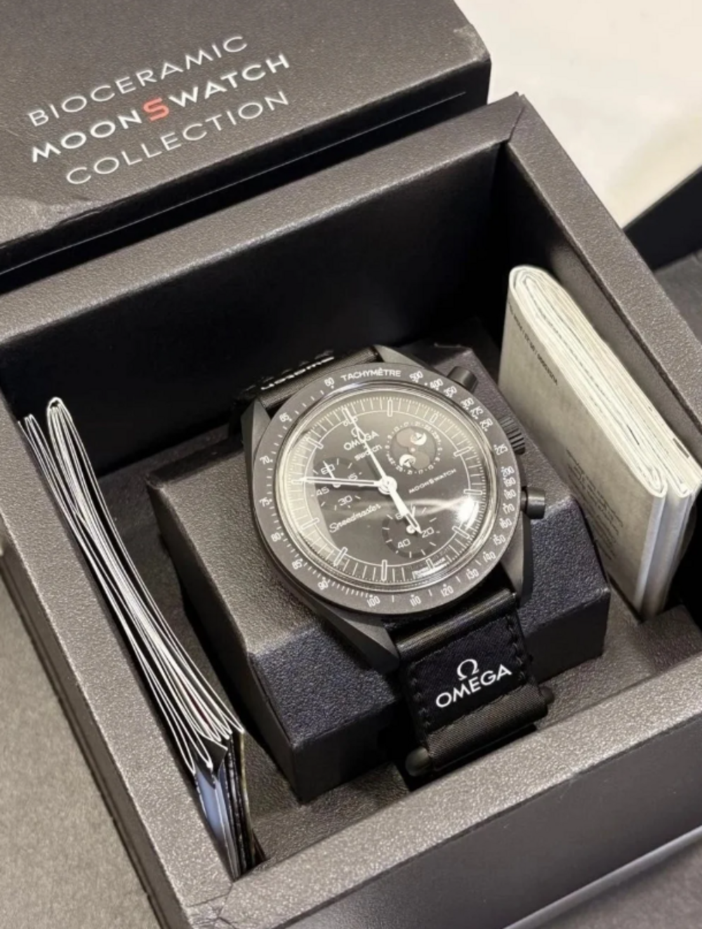 OMEGA x Swatch MISSION TO THE MOONPHASE NEW MOON Black Bioceramic Snoopy Watch.